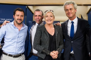French far-right National Front party leader Marine Le Pen, second right, poses for photographers with Dutch far-right Freedom Party leader Geert Wilders, right, Austria's Secretary General of the Freedom Party Harald Vilimsky, second left, and Federal Secretary of Italy's Lega Nord Matteo Salvini after a meeting with EU far-right parties at the European Parliament in Brussels, Wednesday May 28, 2014. Marine Le Pen, the French shock winner in the European elections, has come to the home of the European Union, the organization she blames for undermining France's economy, hamstringing its sovereignty and flooding it with immigrants. (AP Photo/Geert Vanden Wijngaert)