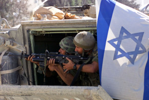 ISRAELI SOLDIERS PREPARE TO SHOOT TEARGAS GRENADES AT PALESTINIAN BOYS IN BETHLEHEM'S DEHEISHE REFUGEE CAMP