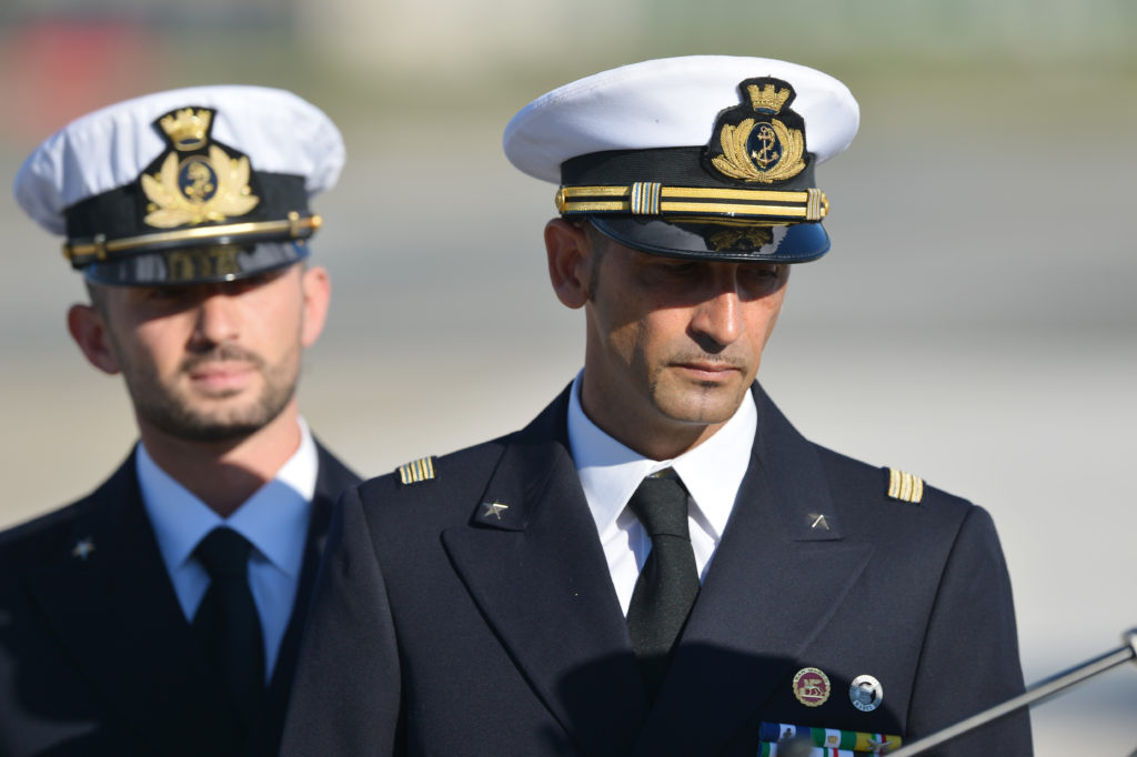 Italian marines Massimiliano Latorre ( R ) and Salvatore Girone ( L ) arrive at Ciampino airport near Rome, on December 22, 2012.An Indian court allowed two Italian marines awaiting trial for shooting two fishermen to go home for Christmas, despite prosecution fears that they will not return. The marines shot dead the fishermen off India's southwestern coast near the port city of Kochi in February while guarding an Italian oil tanker, but they deny murder on the grounds that they mistook their victims for pirates. AFP PHOTO/ VINCENZO PINTO (Photo credit should read VINCENZO PINTO/AFP/Getty Images)